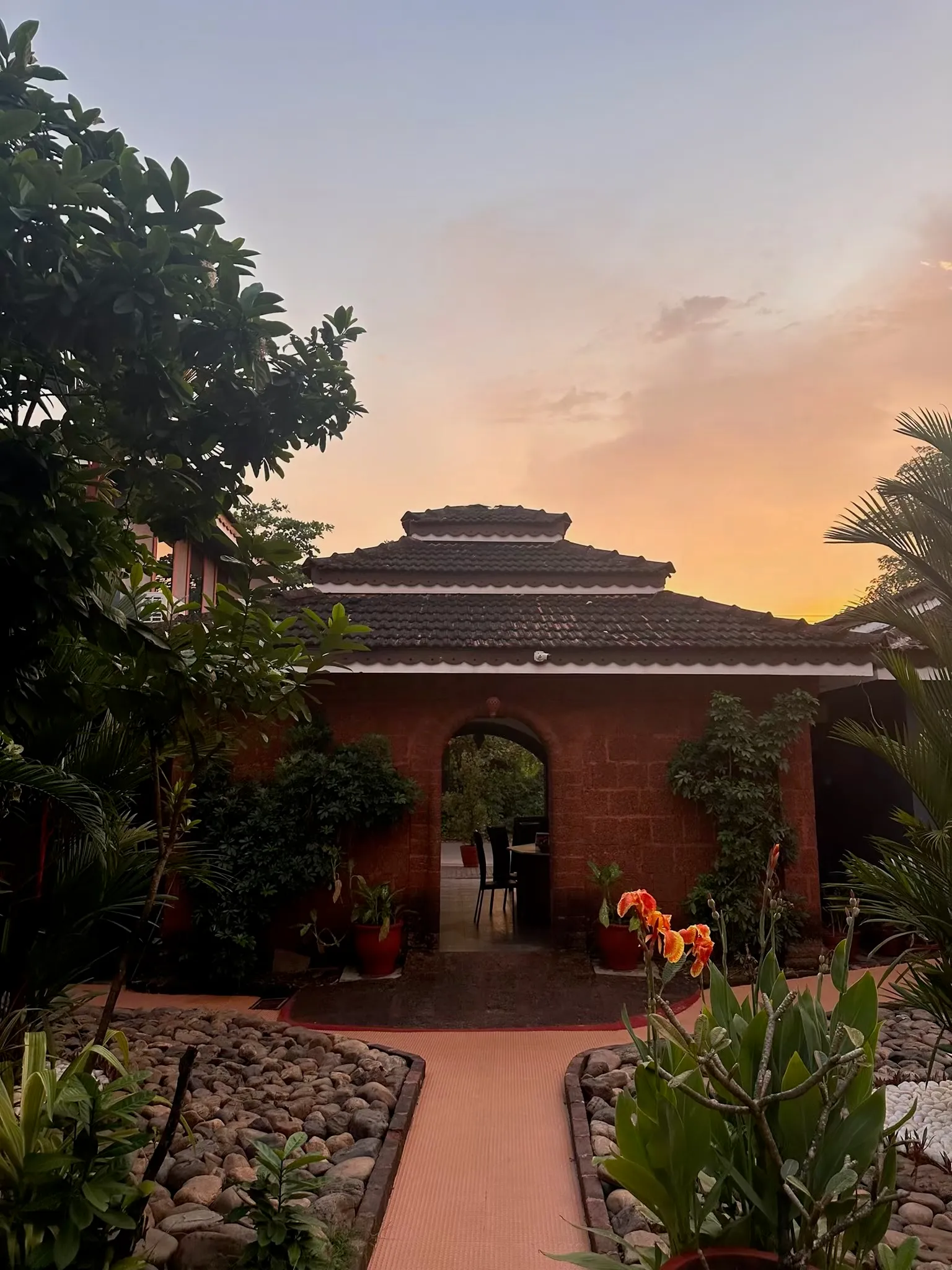 Sunset over the entrance archway at Skylark Resort